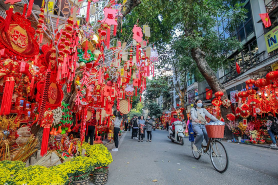 Which stores and tourist attractions are open during Lunar New Year in Hanoi?